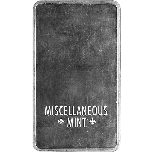 Back of a silver bar engraved with "Miscellaneous Mint" and two fleur-de-lis symbols on a textured, unpolished surface.