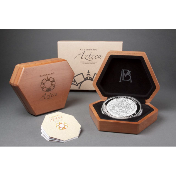 Aztec Calendar silver coin in hexagonal wooden display box with black velvet interior and certificate booklet.
